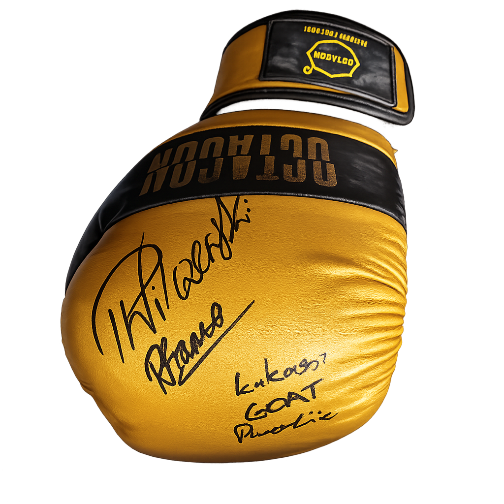 Signed boxing glove by Piotr Wilczewski and Łukasz "Goat" Parobiec in the MMFN memorabilia collection.